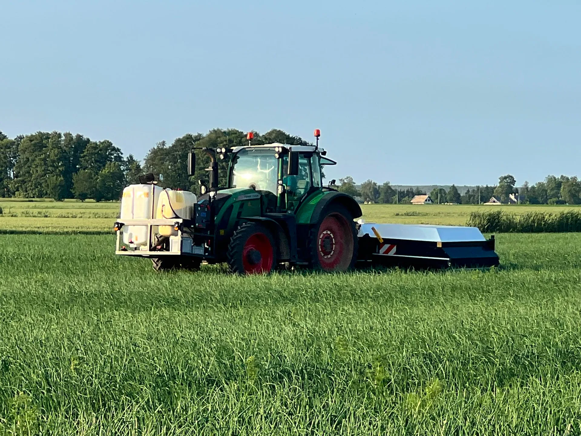 Fendt tractor with the Ecorobotix ARA spot sprayer in the field